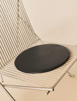 PK4 Loungestol i natur, stålstel af Poul Kjærholm